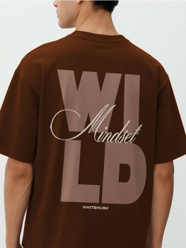 Brown tee with large stacked 'Wild' letters and a 'Mindset' script overlay